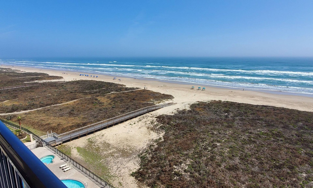 South Padre Island Condo | Beachfront family-sized condo. Stunning views of gulf and bay. Pool and hot tub!