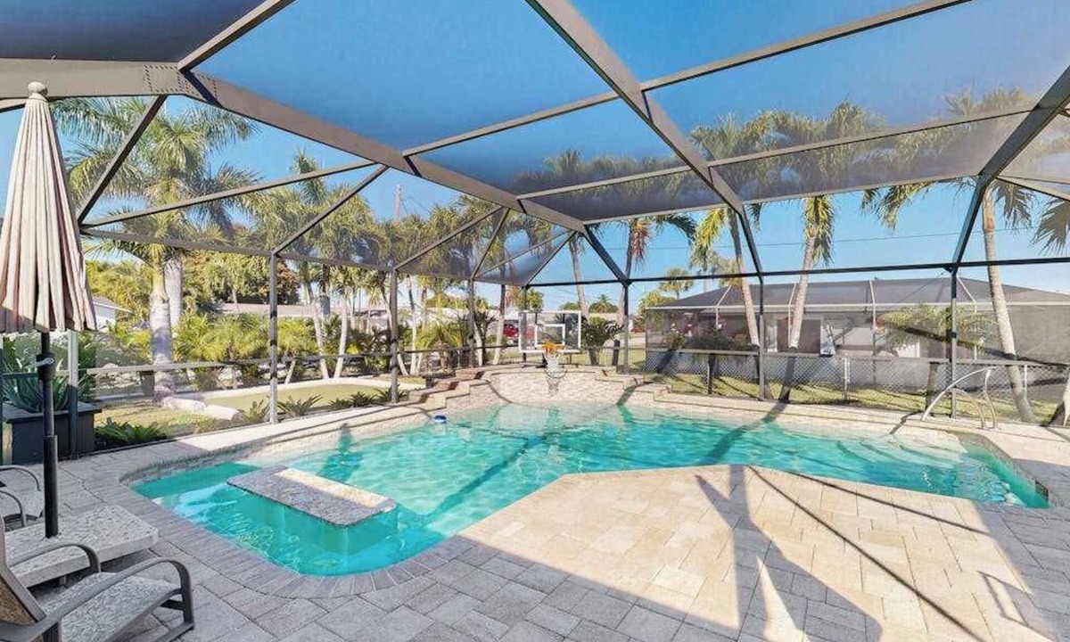 Lochmoor Waterway Estates House | Beautiful, dog-friendly home with in ground pool, putting green & sundeck