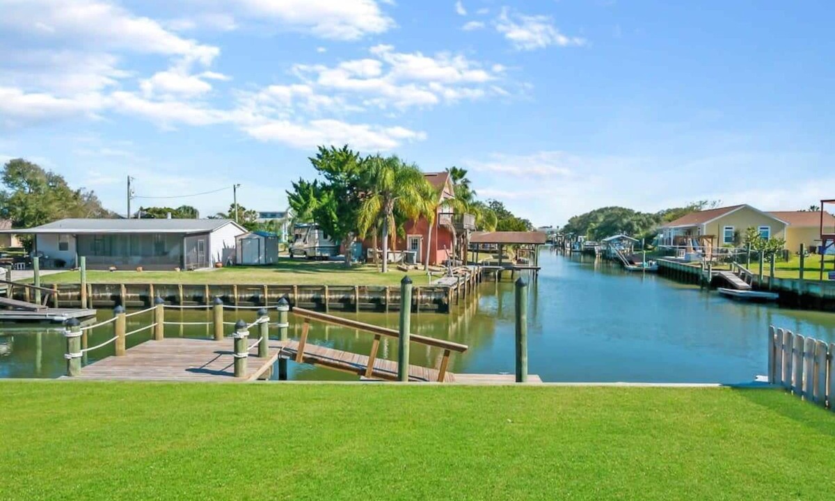 Butler Beach House | Canal Home, Dock, BBQ, Walk to Beach, Fishing