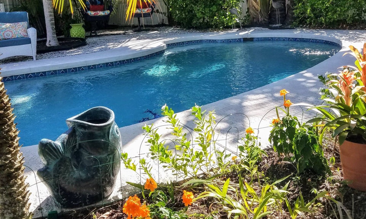 Palm Island House | Enchanted Private Island Oasis Steps To Beach, Tropical Yard & Charm Filled Home