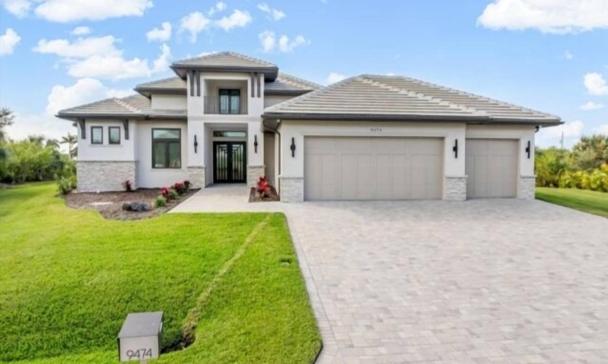 South Gulf Cove House | Indulge in refined waterfront living at this exceptional custom-built residence located in the peaceful community of South Gulf Cove