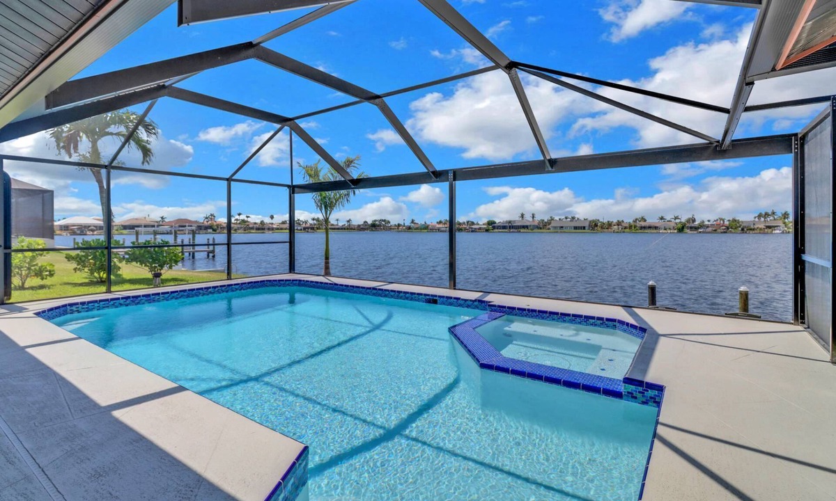 Eight Lakes House | Luxury Gulf-Access Lakefront Retreat | Heated Pool, Spa, Bikes, Kayaks & Dock