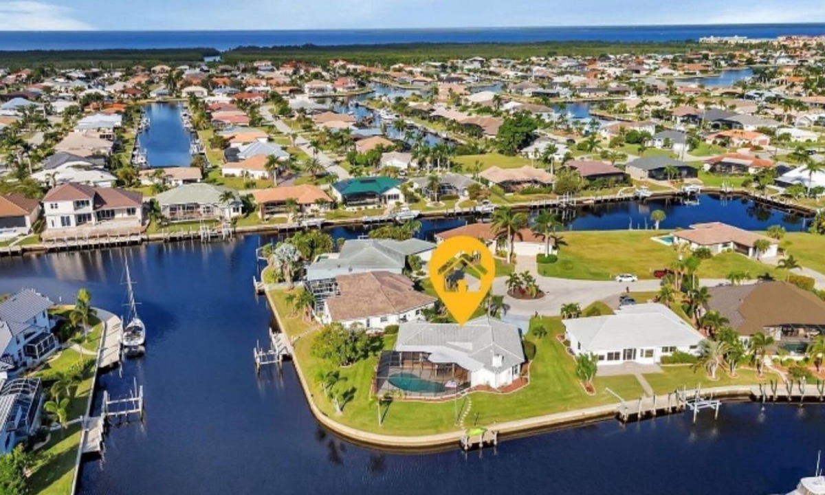 Punta Gorda House | SENSATIONAL! WATER-VIEW, LUXURY REMODEL, SUNNY HEATED POOL, HUGE 145’ SEA WALL