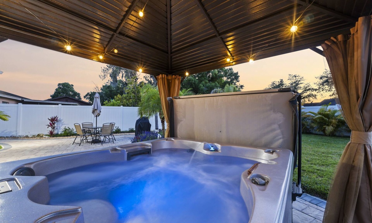 Crystal Lake House | Tropical Fenced Paradise, Hot Tub, & Home Theater