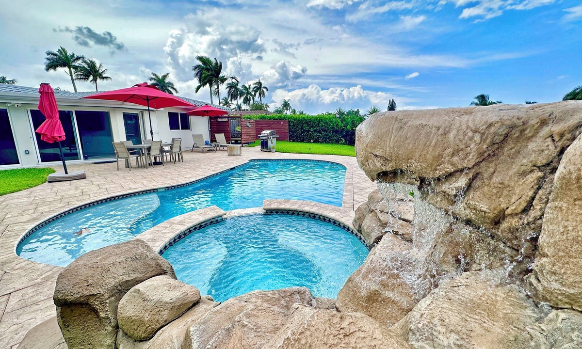 Garden Isles House | Waterfront Oasis – Private Heated Pool & Waterfall Hot Tub