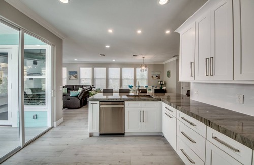 Mid Island House | 261 Key West - Luxurious Beachfront Home with Shared Pool!