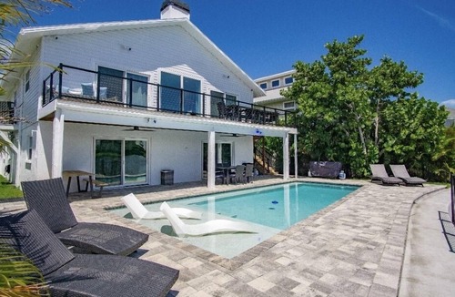 Bay Esplanade House | Beach House on the water with dock, pool & everything to enjoy the beach life.