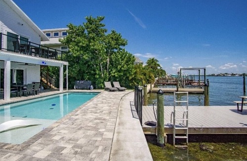 Bay Esplanade House | Beach House on the water with dock, pool & everything to enjoy the beach life.
