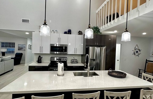 Gardens of Gulf Cove House | Breath taking canal, pool home with golf access. 15 minutes from beaches.