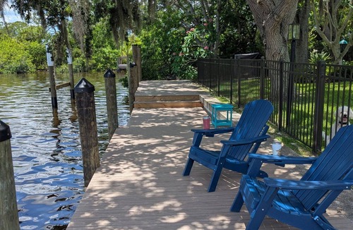 Gulf Cove House | Cozy and private waterfront retreat with hot tub, grill, deck, and firepit!