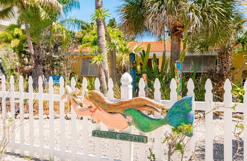 Palm Island House | Enchanted Private Island Oasis Steps To Beach, Tropical Yard & Charm Filled Home