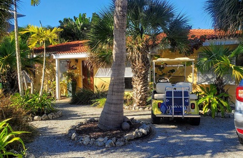 Palm Island House | Enchanted Private Island Oasis Steps To Beach, Tropical Yard & Charm Filled Home