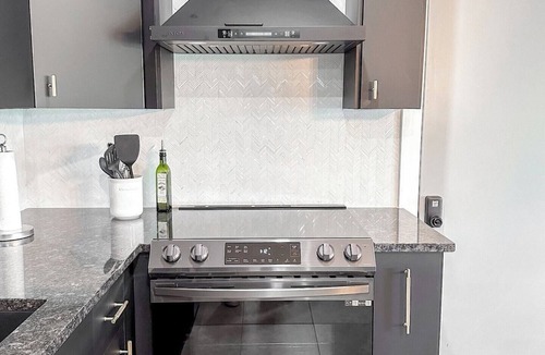 Yacht Club House | Experience modern waterfront living in Cape Coral’s Yacht Club district. Walk to the beach for stunning sunsets, plug in with on-site EV charging, and keep your boat moored at our private backyard dock. Direct gulf access with no bridges!