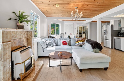 Upper Lonsdale House | Large fully renovated 2-bedroom ground-level suite with a fenced backyard