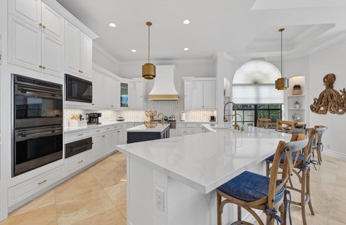Lighthouse Point Villa | Lighthouse 6 BR Mansion, 90ft waterfront dock, heated pool, hot tub and more!
