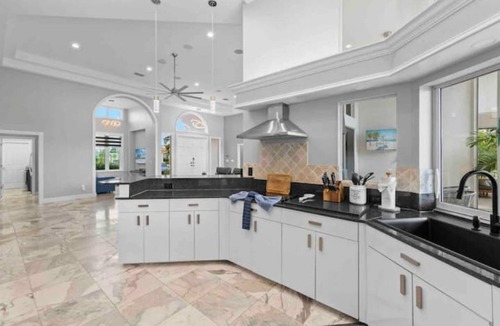 Yacht Club House | Lux Riverfront Retreat~Pool~Spa~Outdoor bar~Tropical Yard~Direct Gulf Access