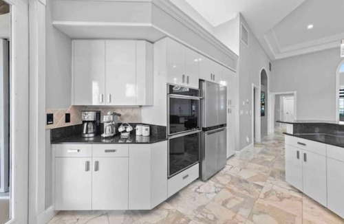 Yacht Club House | Lux Riverfront Retreat~Pool~Spa~Outdoor bar~Tropical Yard~Direct Gulf Access