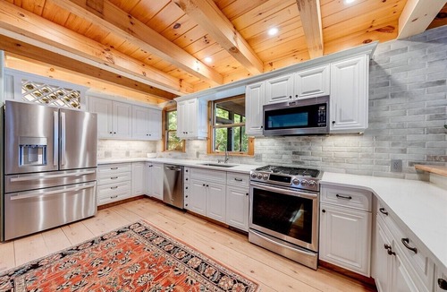 Clarkesville House | Luxury 5BR Lake Burton home with dock, game room, and lakeside views.