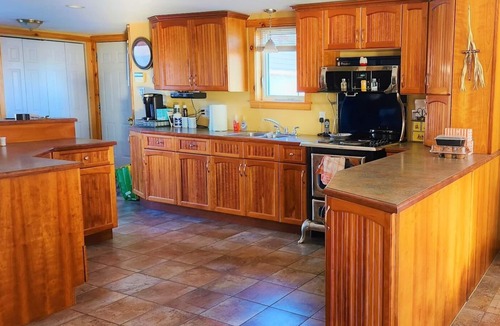 Moncton House | Riverfront Family Home w/Fully Fenced Backyard, screened in front porch, BBQ