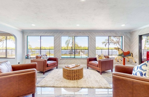 Fort Myers Shores House | Riverfront home - pool, pool spa, dock, & bikes