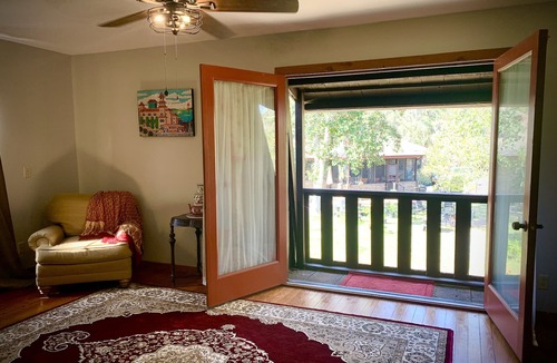 Scottsmoor Cottage | Rocket & Nature Lovers! Vintage European Cottage in a lush Florida Setting