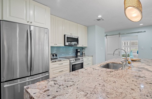Kings Lake House | Rovigo Vacation Rental: Spacious Retreat with Panoramic Lake Views in Kings Lake. 4-BR, 4-Bathroom Home with Private Pool, just 3.4 Miles from the Vibrant Fifth Avenue South and Naples Attractions
