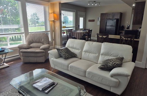 Lower Sumas Mountain Apartment | Scenic 2 bdrm walkout suite with shared hot-tub, outdoor pool, and view of park.