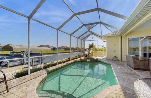 South Gulf Cove House | Serene and elegant with heated pool, water views, family and dog friendly, W/D