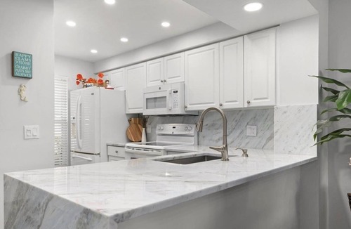Plantation Condo | SUMMER SALE! Remodeled PGA Golf & Country Club condo on 10th hole!