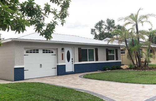Crystal Lake House | Tropical Fenced Paradise, Hot Tub, & Home Theater
