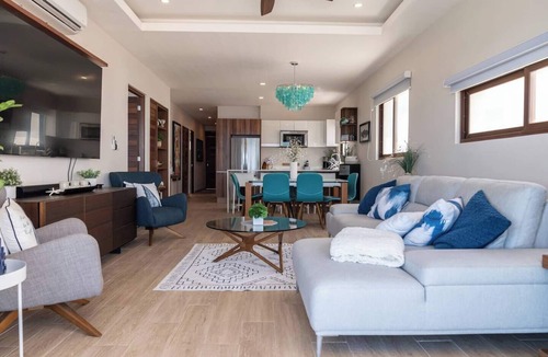 Centro - Supmza 001 Apartment | Wake up to turquoise waters at Isla Bliss 🌴 — a luxury 3-bedroom oceanfront condo just minutes from Isla Mujeres’ best dining and beaches. Enjoy a 90" Smart TV, stunning views, fast WiFi, and easy self-check-in for the perfect island escape. 🌊✨