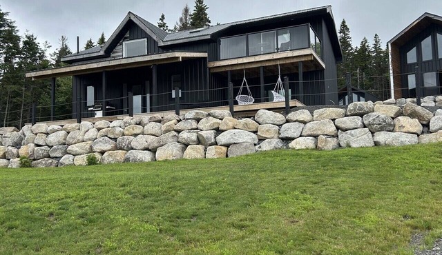 A modern three bedroom house with skywalk; perched at the highest topographic point of the estate.