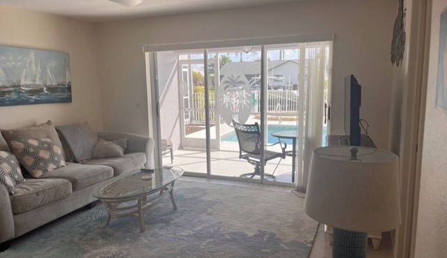 Charming 2-bedroom condo with WiFi, in Cape Coral with pool, spa, & water view.