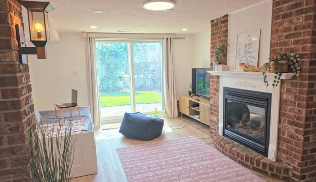 Cozy Retro Suite with Garden Walkout, Games & Lounge!