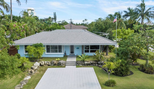Custom remodeled home with tropical setting in exclusive Harbor Inlet community