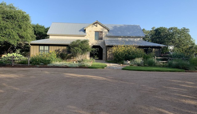 Dog-Trot Home on secluded acreage with pool and game room.