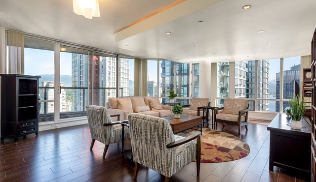 Elevated Coal Harbour living with panoramic harbour & mountain views, steps to Vancouver's iconic waterfront, dining and shopping.
