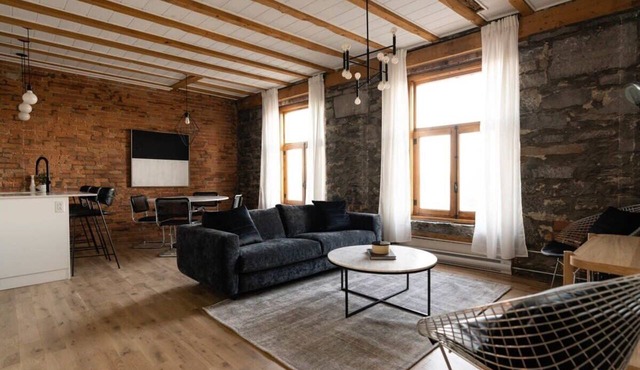 Maison Place Royale Luxury Waterfront One-Bedroom Apartment Old Montreal Water View St. Lawrence River Full Kitchen Stone Walls Wi-Fi AC