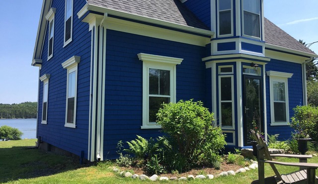 Modernized waterfront heritage homestead with entertainment barn