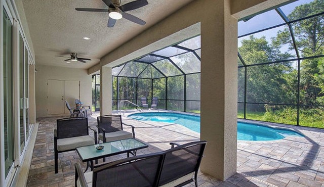 Open Concept home with Heated Pool in peaceful North Port 3 Bdrm, 4 Bath + Den