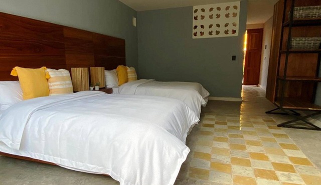 Preciosa habitación con 2 camas matrimoniales en el centro de Mérida.