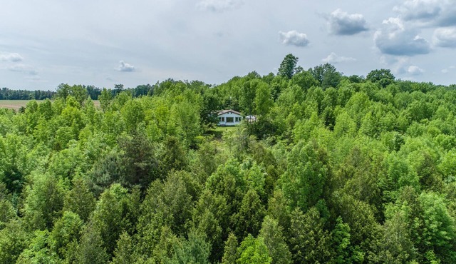 Secluded 3 bedroom bungalow on the Saugeen River with 85-acres.
