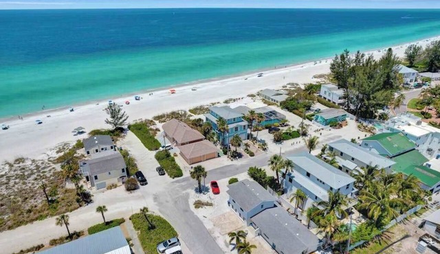 Serene oceanfront suite with Gulf view, grill, patio, central AC, & WD