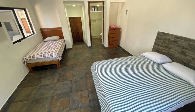 Very comfortable suite with 1 QS + 1 twin bed, AC. Only 2 blocks from beach.