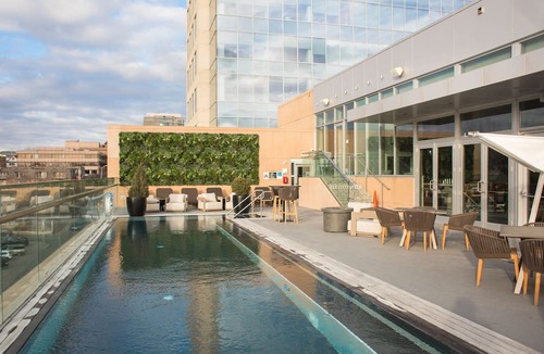 West Plaza Hotel | Family Getaway! 2 Spacious Units, Pool, Pets Allowed Near Rockhurst University!