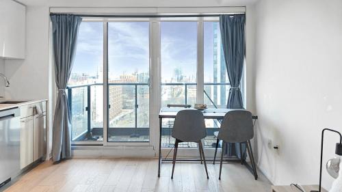 Garden District Apartment | Absolute Heart of Toronto Electric Downtown Studio by Eaton Centre & Dundas Sq
