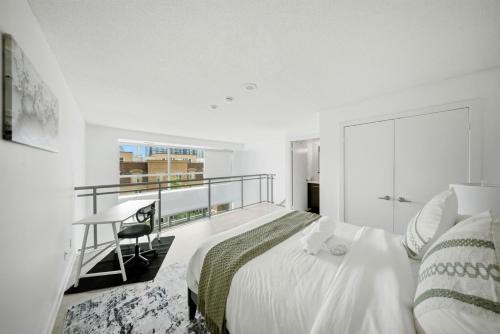 Downtown Loft style Condo with Pool Gym and Balcony